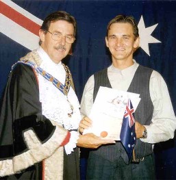 The Lord-Mayor of the Gold Coast hands me over the certificate of the Australian citizenship. The